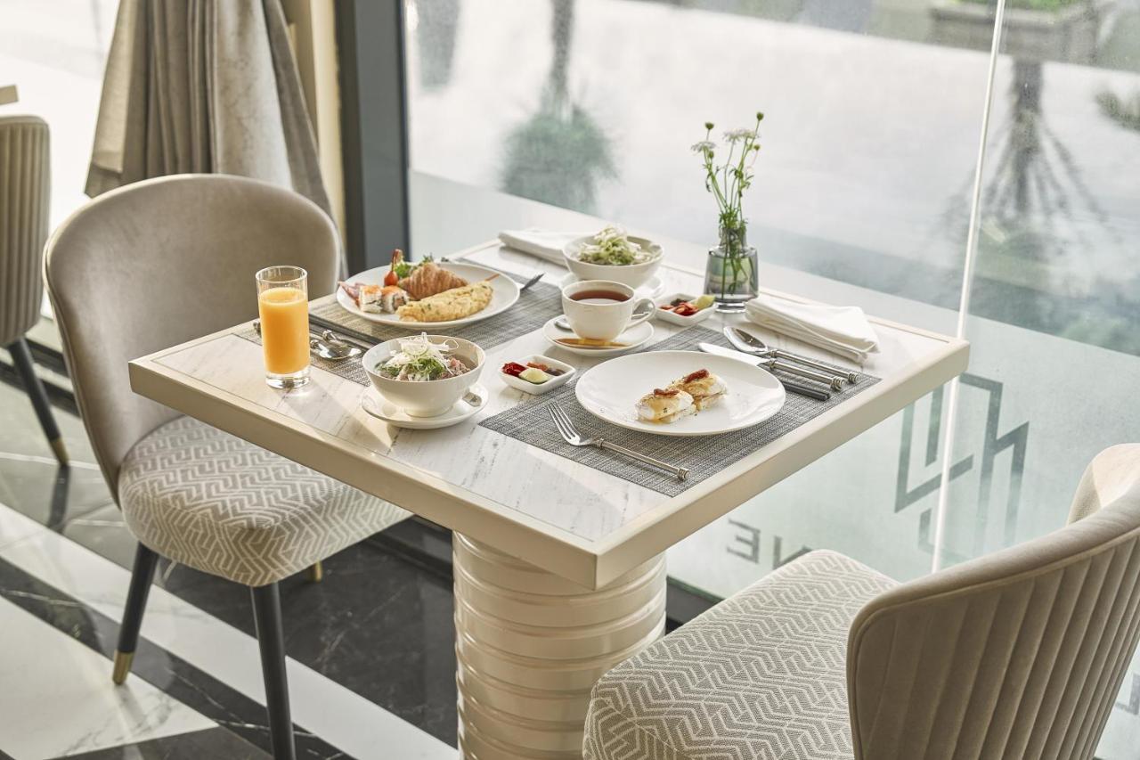 La Siesta Premium Saigon Hotel Ho Chi Minh-Byen Eksteriør billede A table set for breakfast